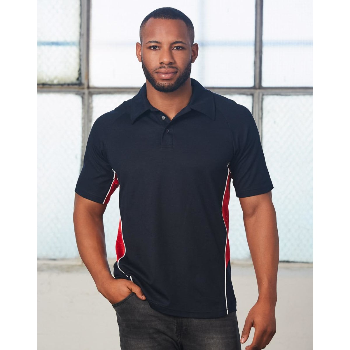 A black polo shirt with red and white detailing, featuring a logo on the chest.