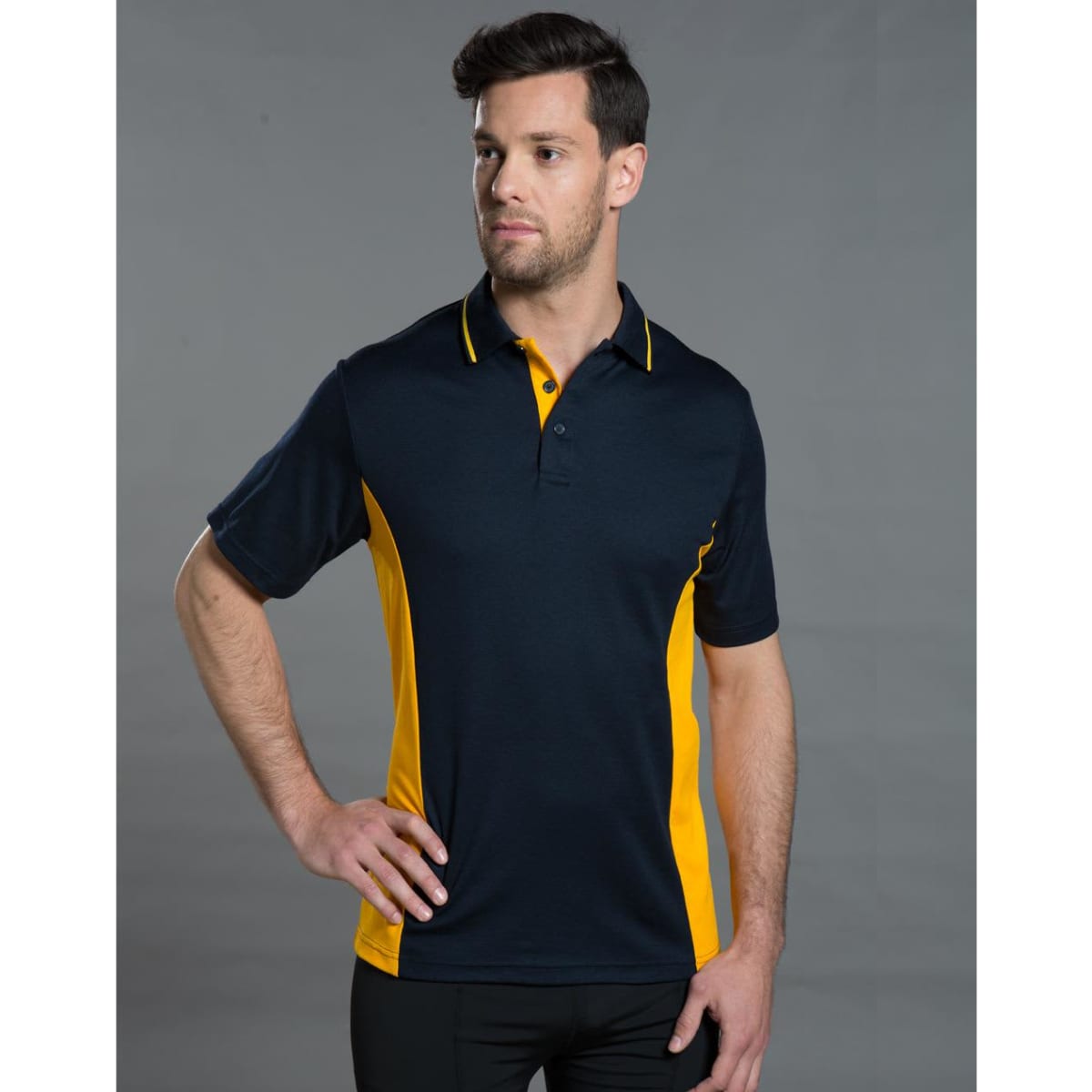Men's TrueDry Contrast short sleeve polo in navy with yellow side panels, featuring a logo.
