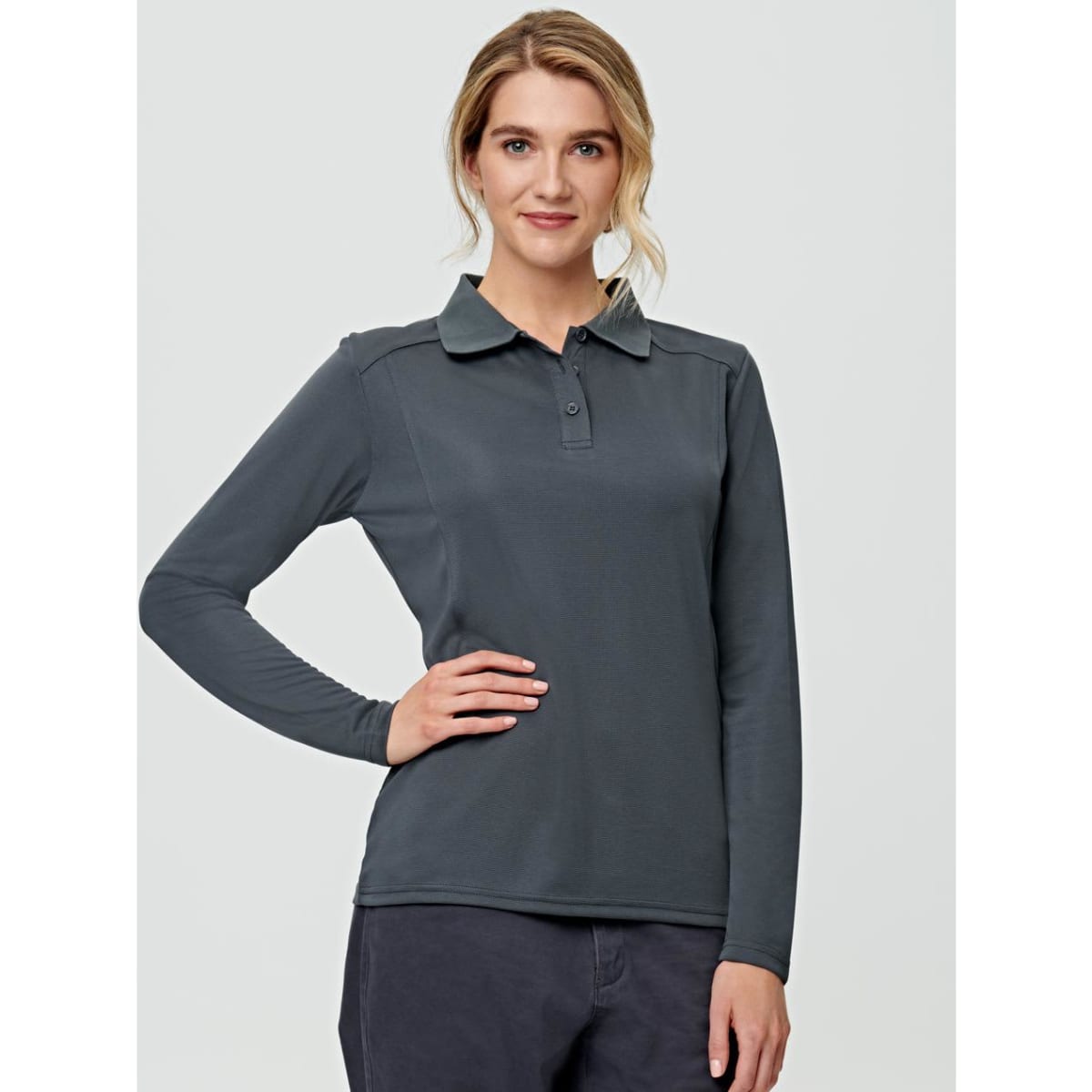 A long-sleeved polo shirt in dark grey, featuring a collar and button detail, with a logo on the chest.
