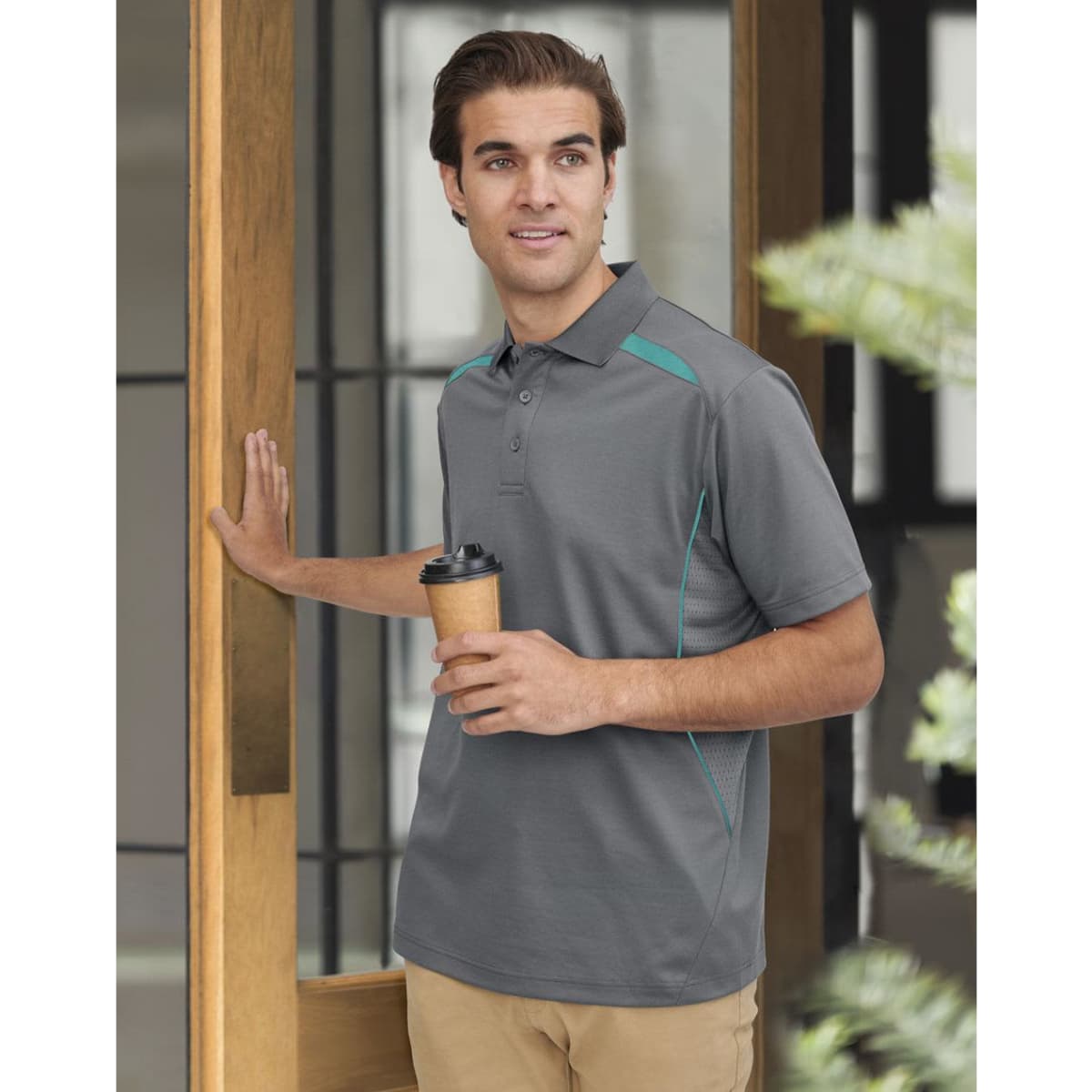 Men's short-sleeve polo in grey with teal contrast detailing, featuring a logo. Styled for a casual look.