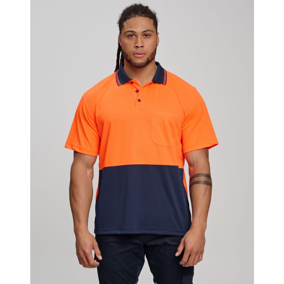 A high-visibility short-sleeve safety polo in bright yellow with a navy blue bottom section and a pocket.