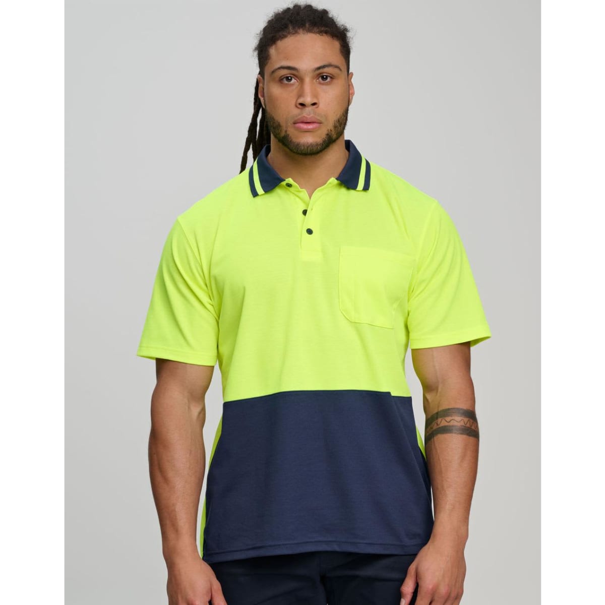 A bright orange and navy safety polo with a collar and short sleeves. It includes a pocket and features a logo.
