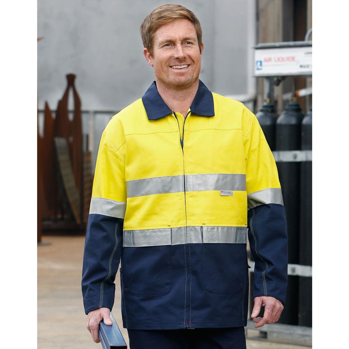 A Hi-Vis two-tone work jacket in yellow and navy with reflective 3M tapes, featuring a logo on the chest.