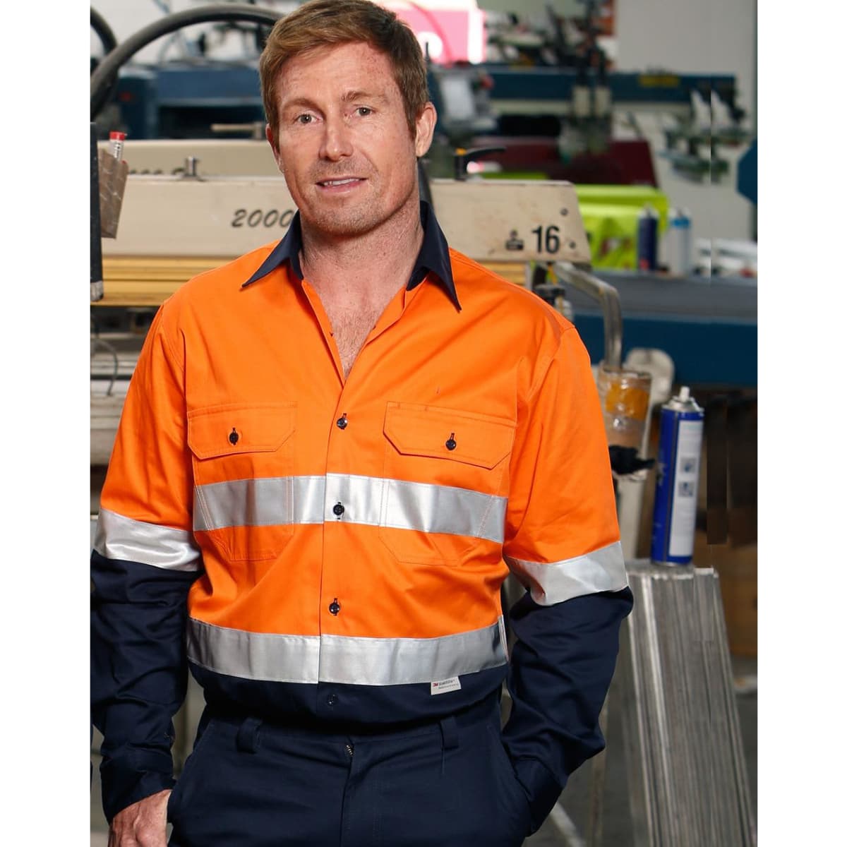 Men's long-sleeve safety shirt in hi-vis orange with reflective tape, featuring a black collar, and a logo.