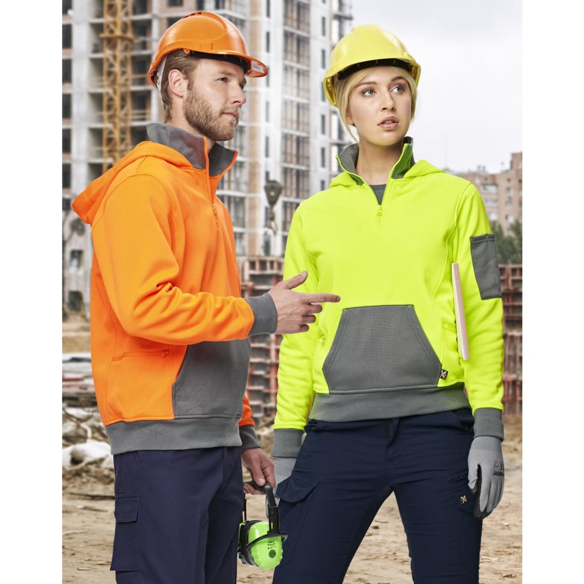 A premium fleece two-tone hoodie in orange and grey, and a high-visibility hoodie in yellow and grey, worn by two workers.