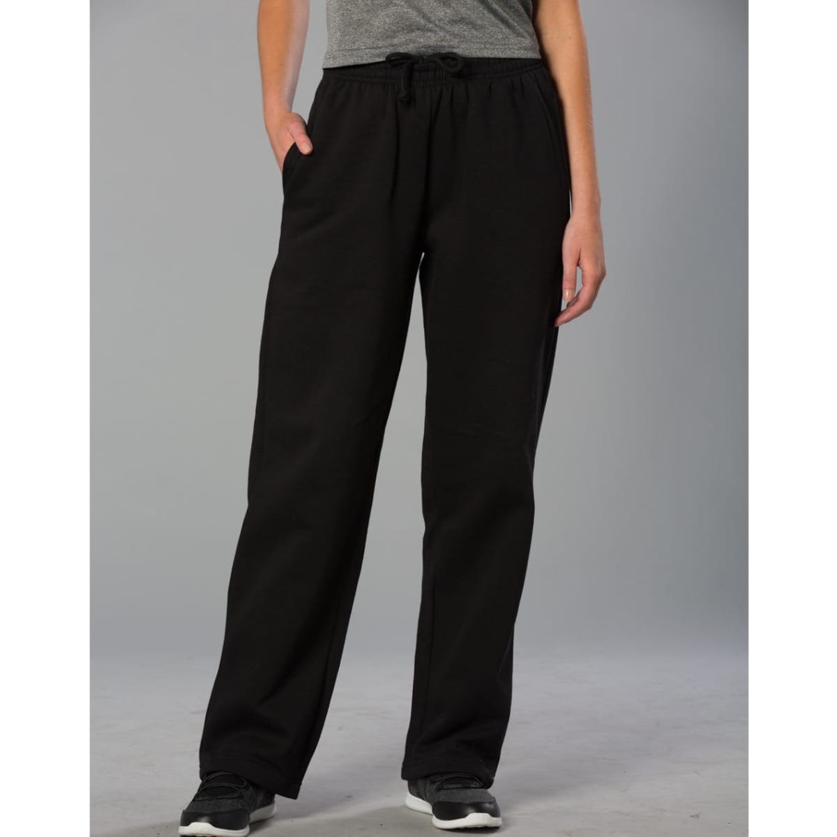 Adult fleecy pants in black, featuring a drawstring waist and side pockets, styled with a casual fit.