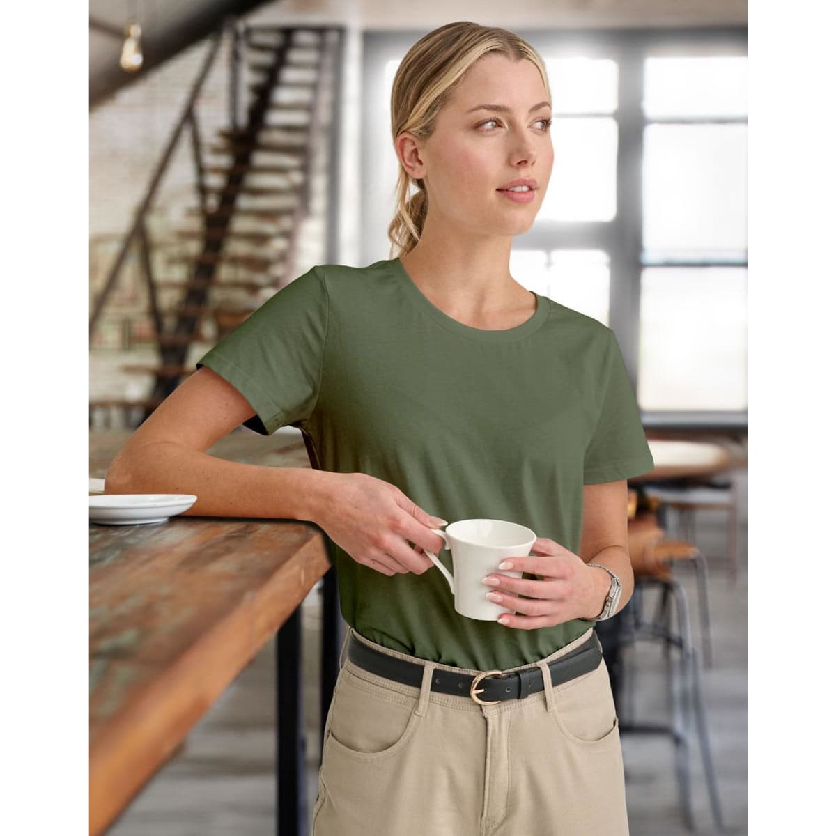 A black premium cotton tee for women, featuring short sleeves and a fitted design. The shirt includes a logo.
