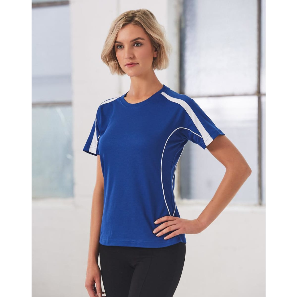 A blue ladies' T-shirt with white accents, featuring a logo on the front. Designed for casual wear.
