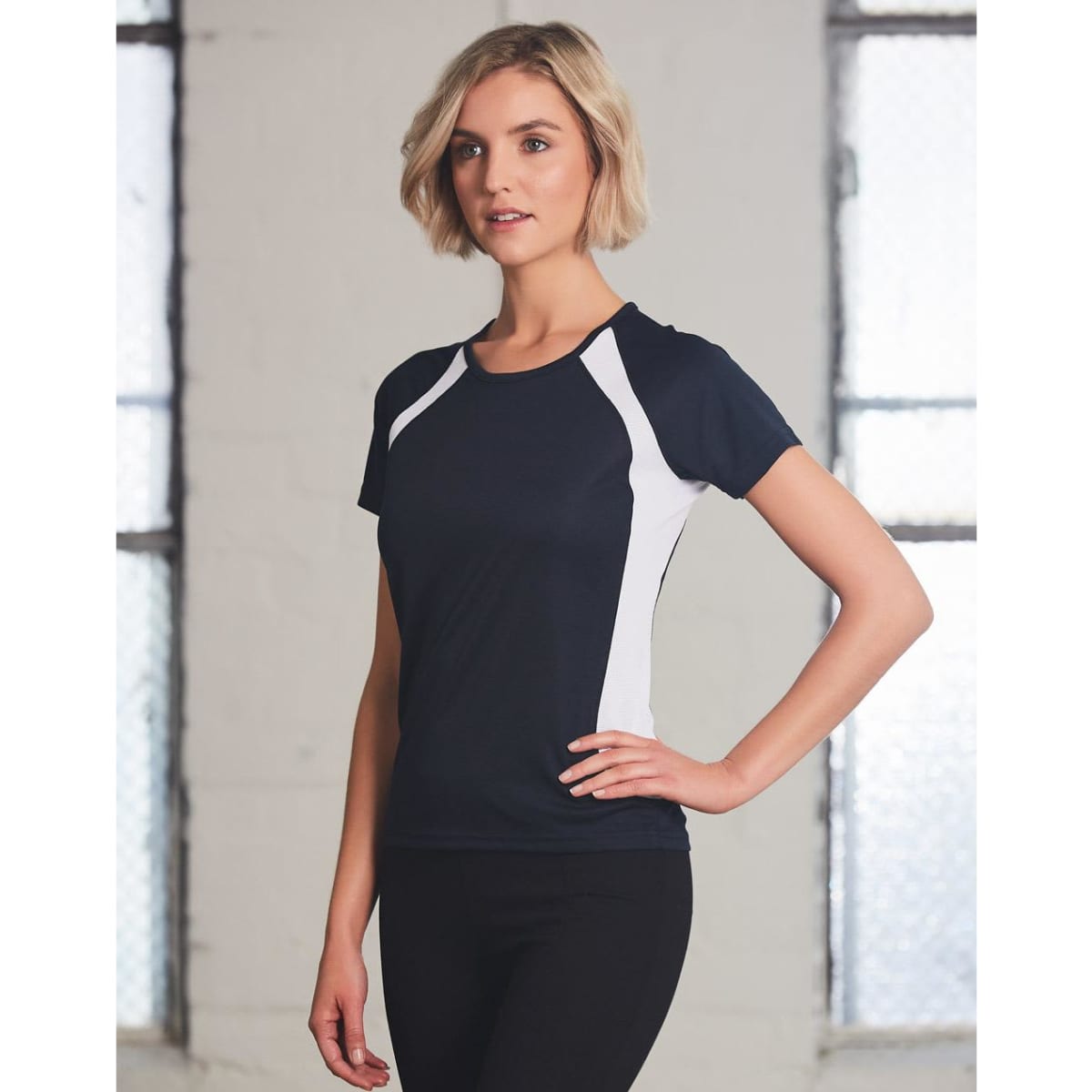 A navy and white ladies' tee shirt with a fitted design, featuring a logo on the chest area.
