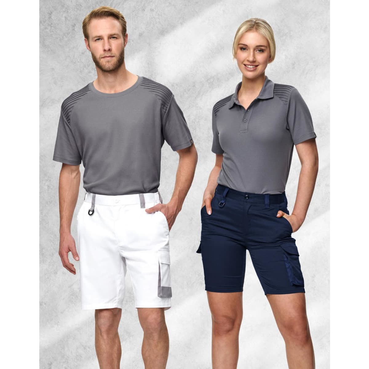 Unisex utility stretch cargo work shorts in navy, featured with a logo, styled alongside a grey t-shirt and polo.