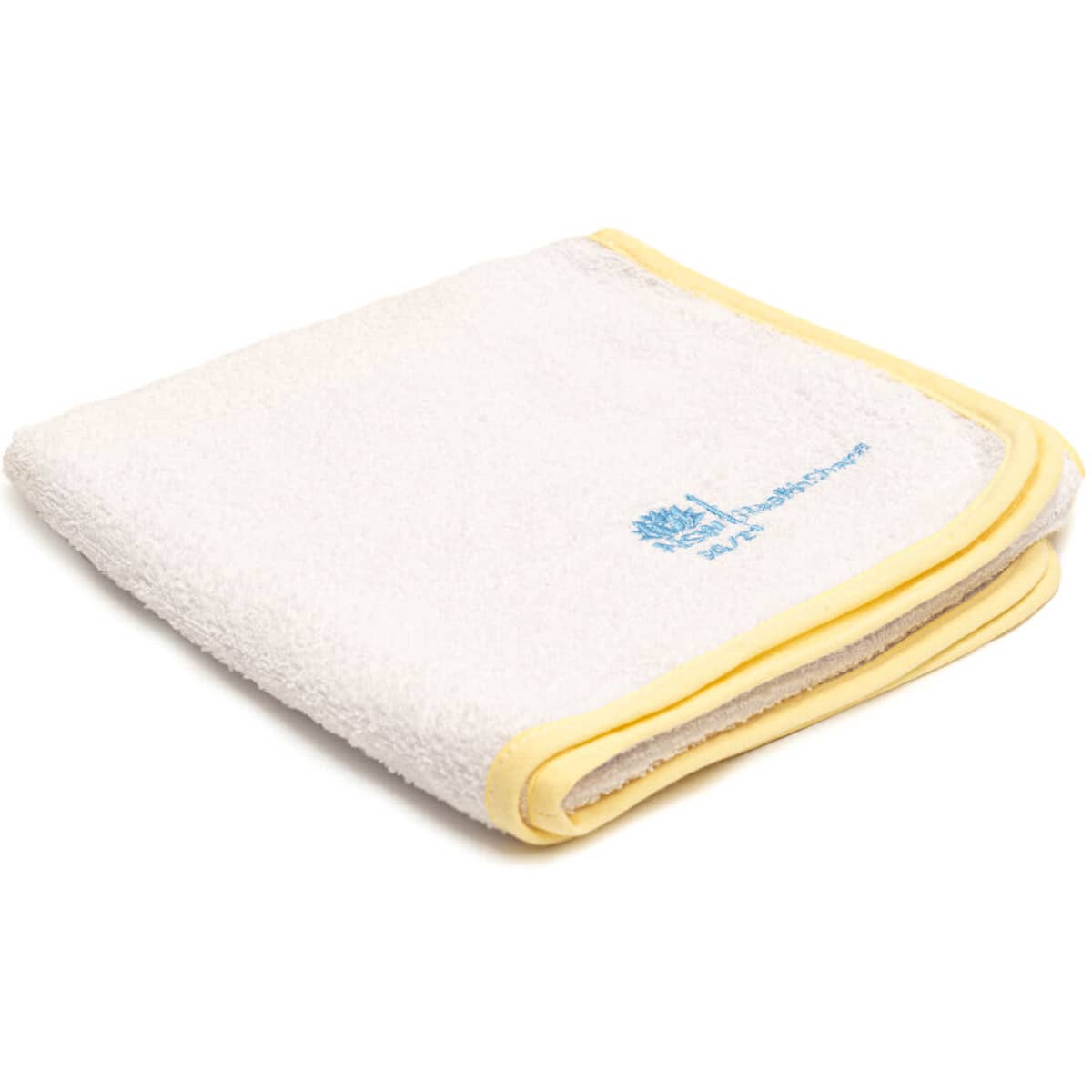 A folded white towel with a yellow border and a small logo in the corner.