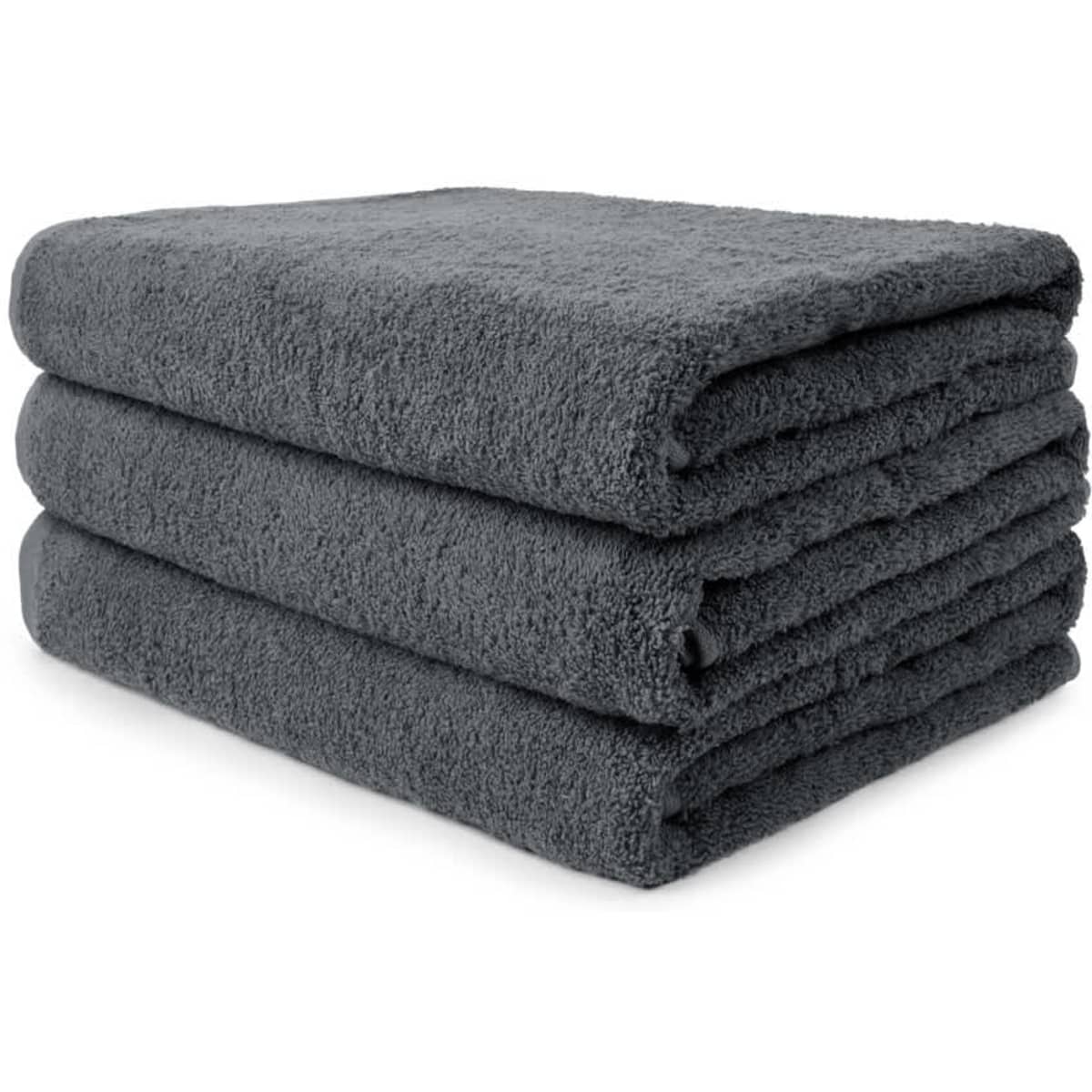 A stack of three dark grey towels, featuring a plush and soft texture. The towels are neatly folded.