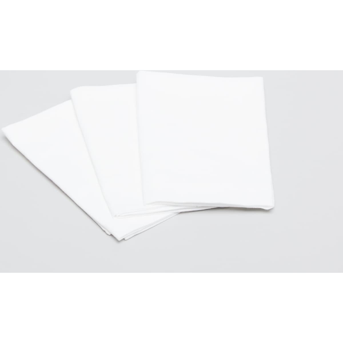 Three white cotton tea towels folded neatly, arranged on a light grey background. One towel has a logo.