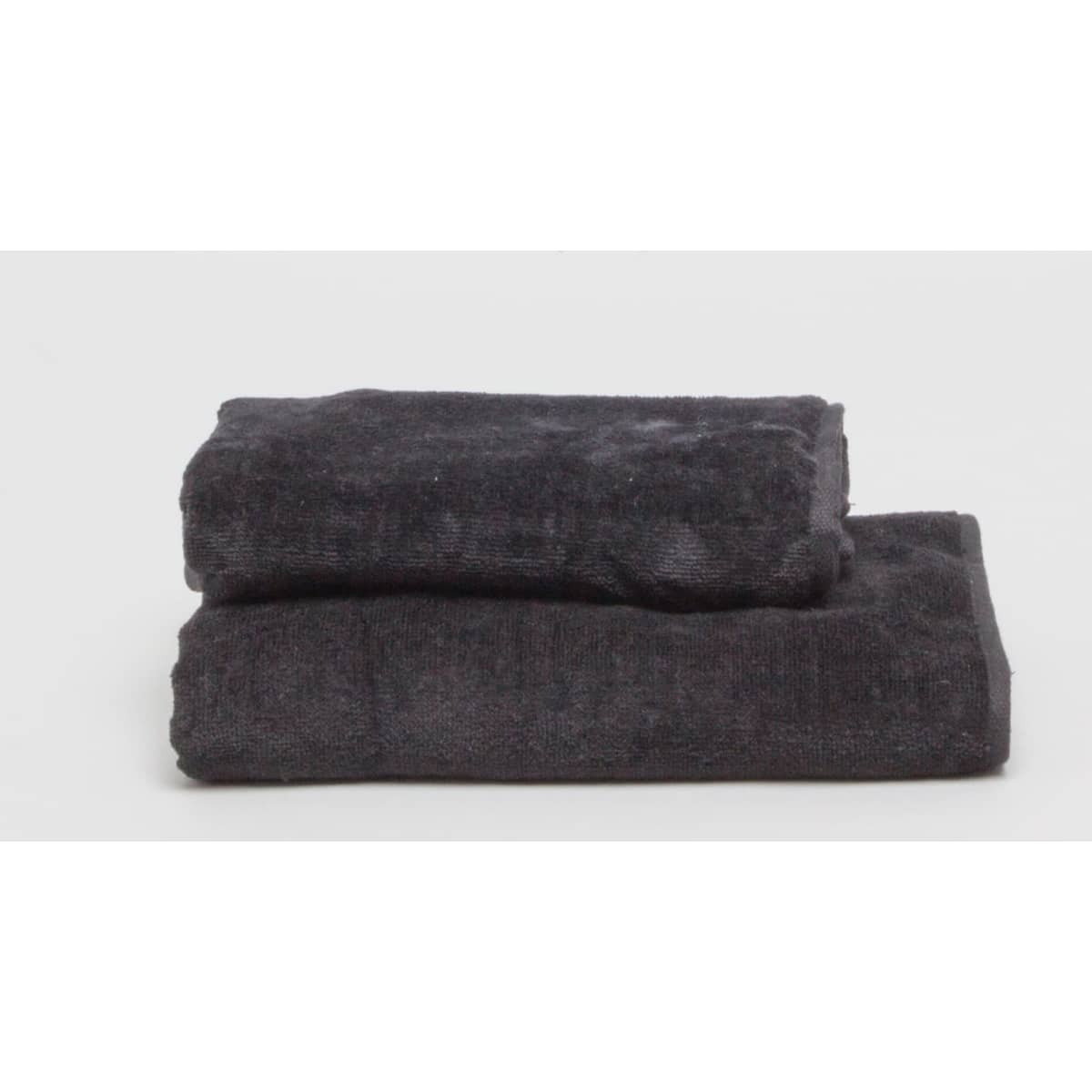 Two black hand towels neatly stacked on a white background. The towels have a soft, textured appearance.