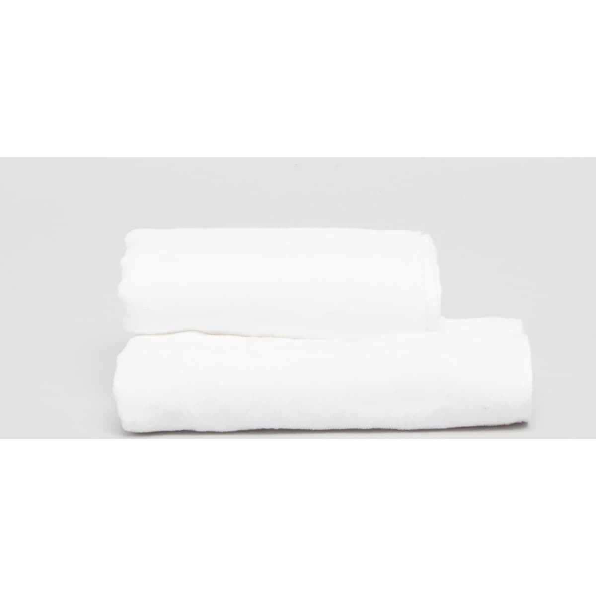 Two neatly rolled white hand towels on a light grey background. The towels have a soft texture and a logo.