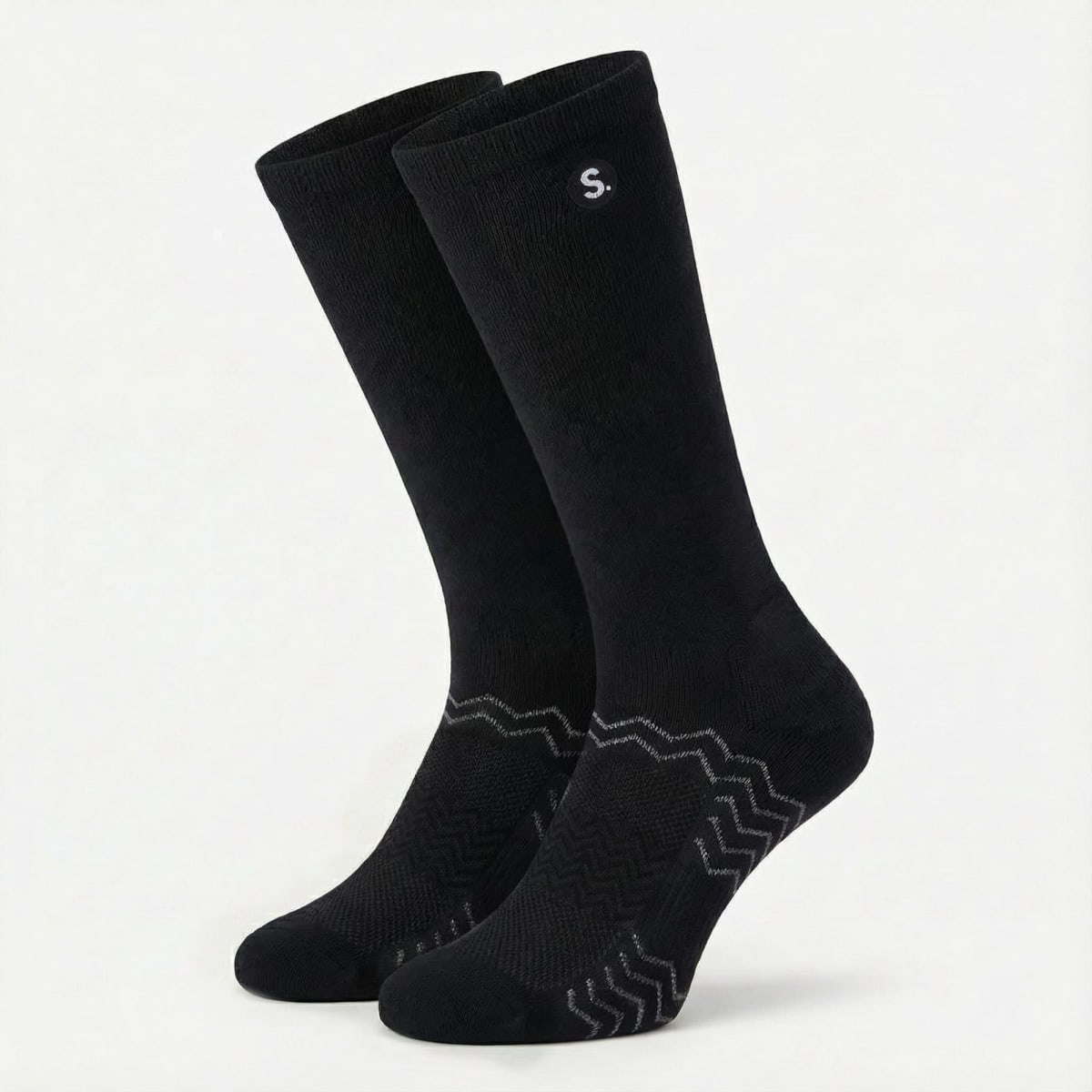 A pair of black equestrian socks featuring a subtle logo and a textured design at the base.