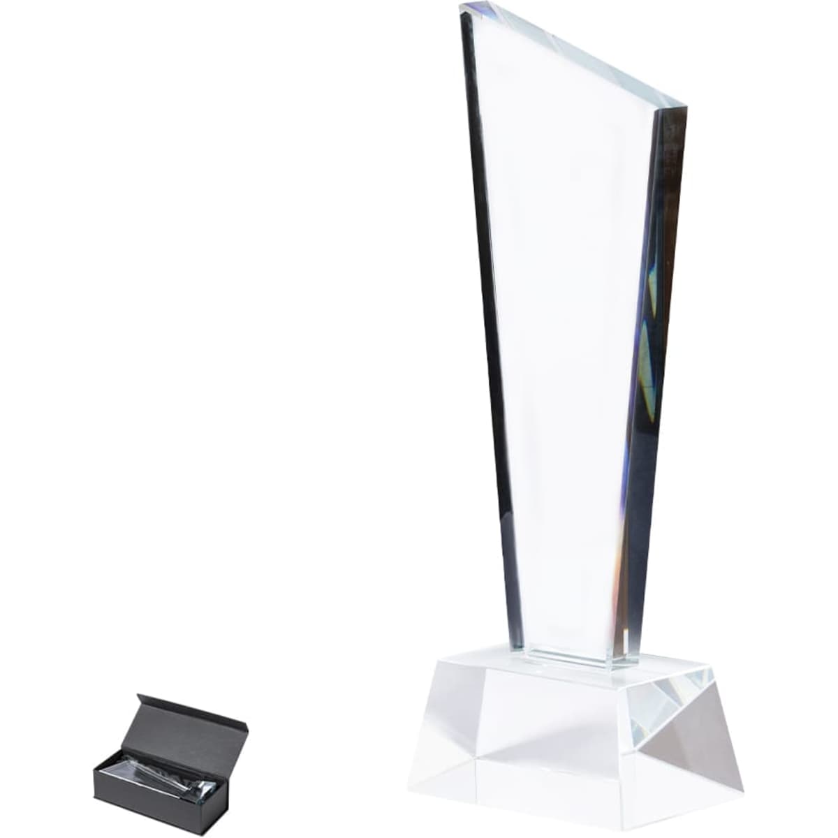 A crystal trophy with a clear, angular design on a faceted base, displayed with a black presentation box.