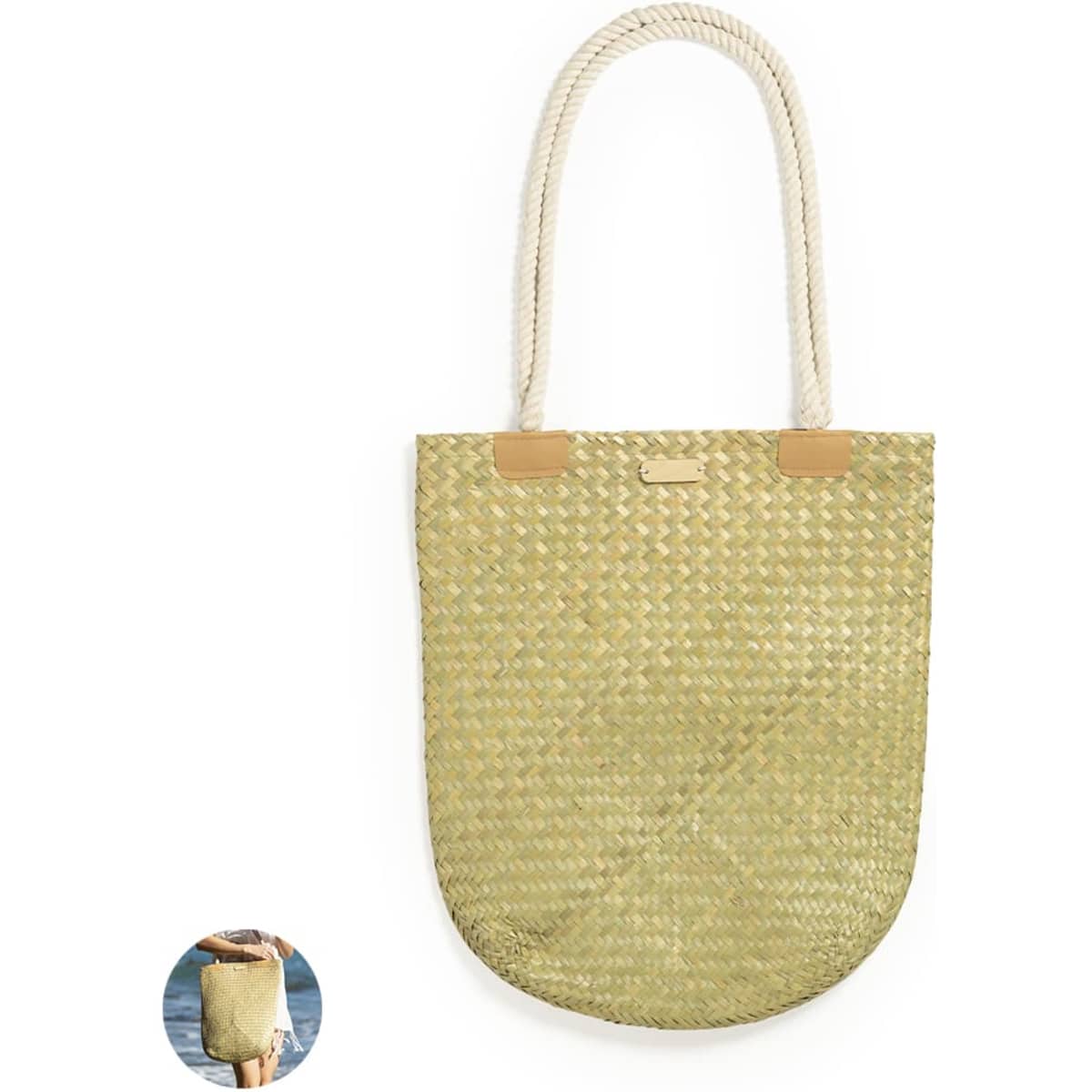 A woven tote bag in light green with rope handles and leather accents, featuring a branding logo.