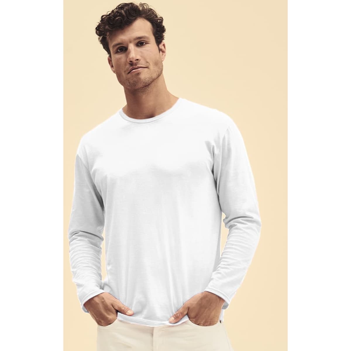 A white long sleeve T-shirt featured on a model standing against a plain background. The shirt has a subtle logo.
