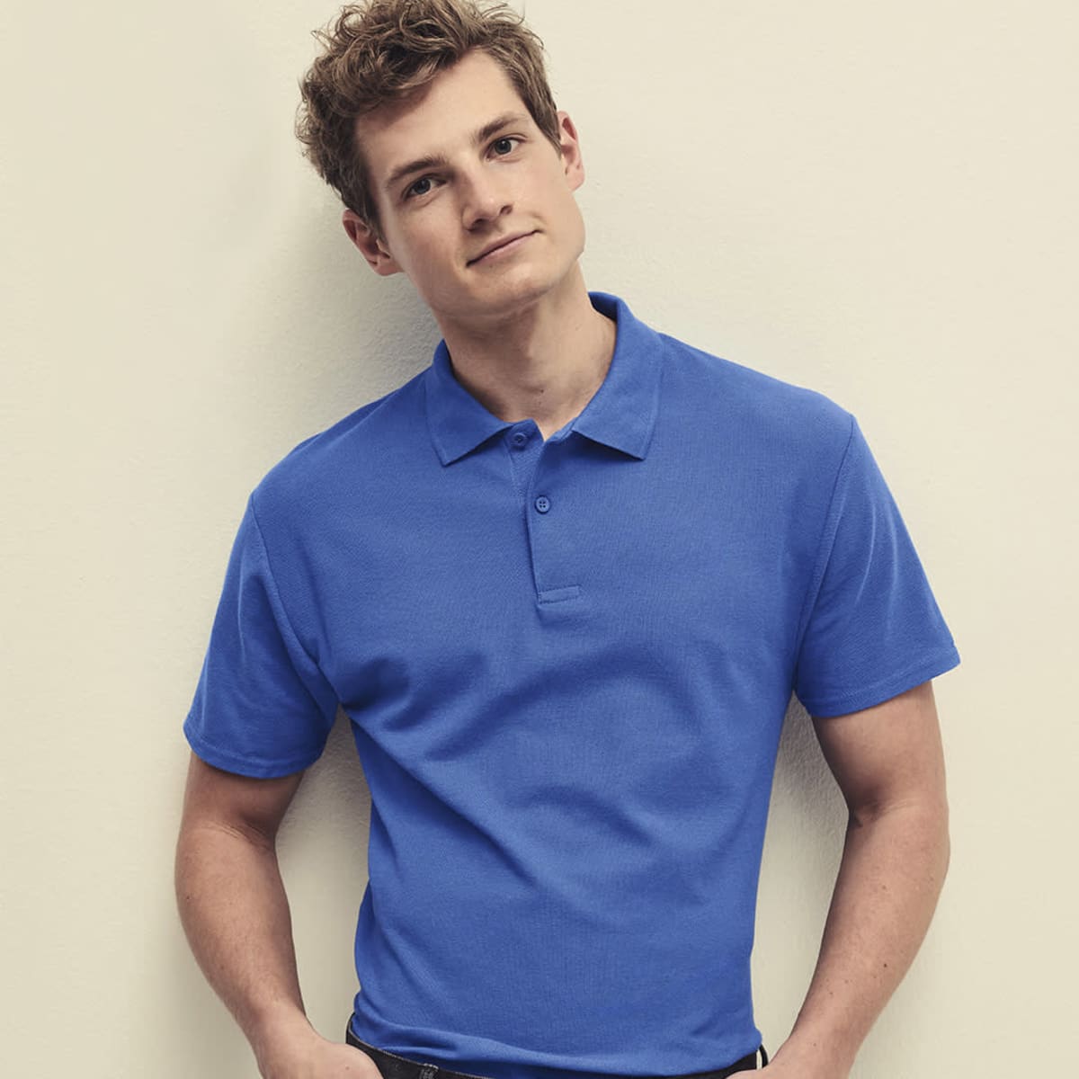 A blue polo shirt with a collar, featuring a branding logo, displayed on a model.