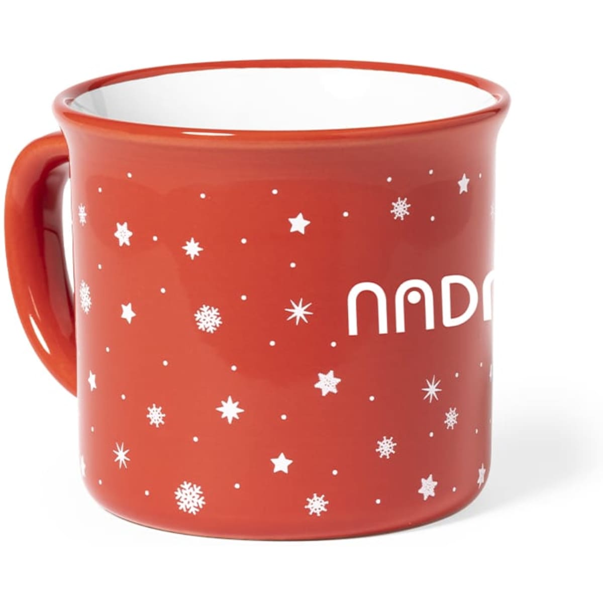 A red coffee mug with a glossy finish, featuring a pattern of white stars and snowflakes, and a logo.