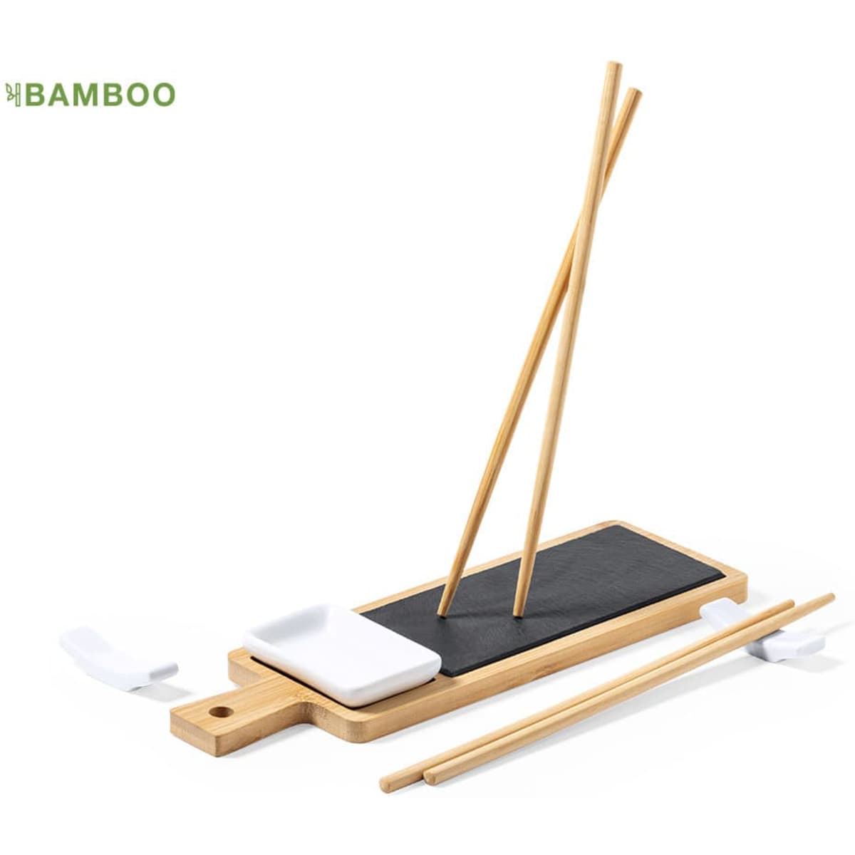 A bamboo sushi set featuring a black plate, white dipping dish, and two pairs of bamboo chopsticks.