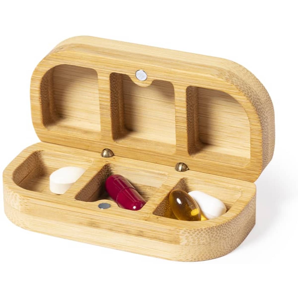 A bamboo pill organiser with three compartments, containing various tablets and capsules in red, white, and yellow.