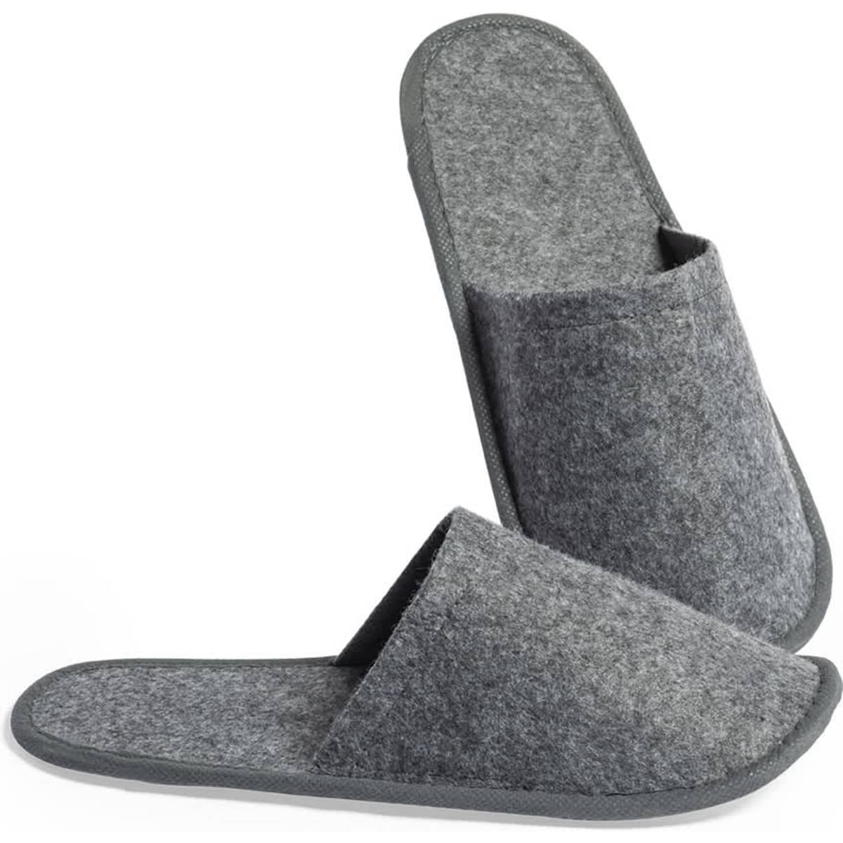 A pair of grey felt slippers with a simple design and a logo on the side.