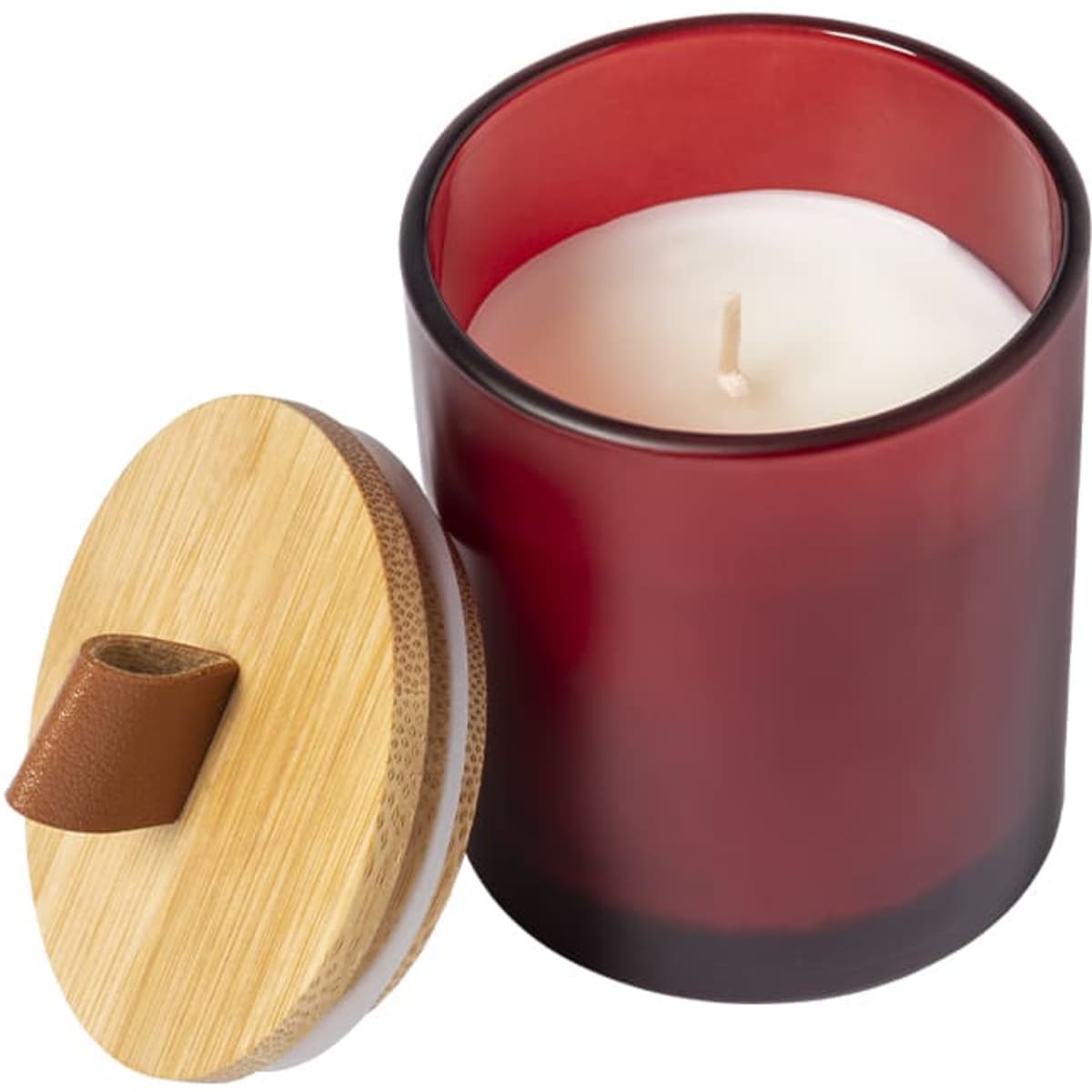 A red glass candle with a white wax interior, featuring a bamboo lid with a leather strap. It has a branding logo.