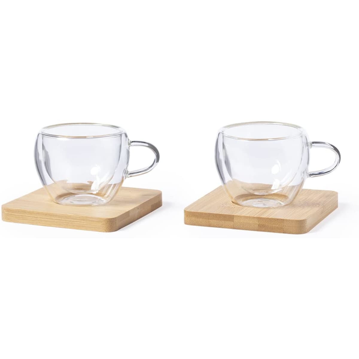 A pair of clear glass cups with handles, set on wooden coasters. The cups are symmetrical and elegantly designed.