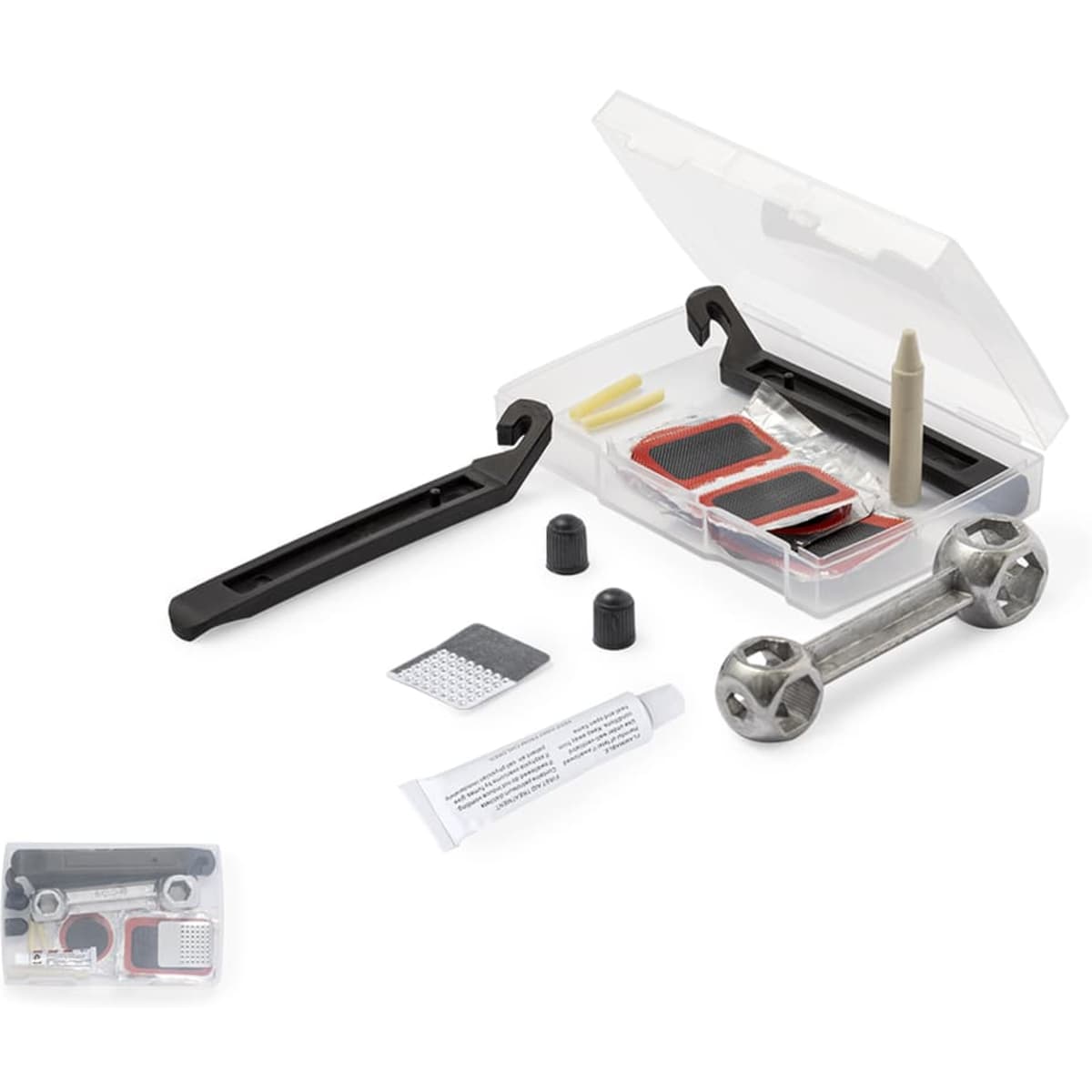 A compact repair kit contains various patches, adhesive, and a small wrench in a transparent case with a black handle.