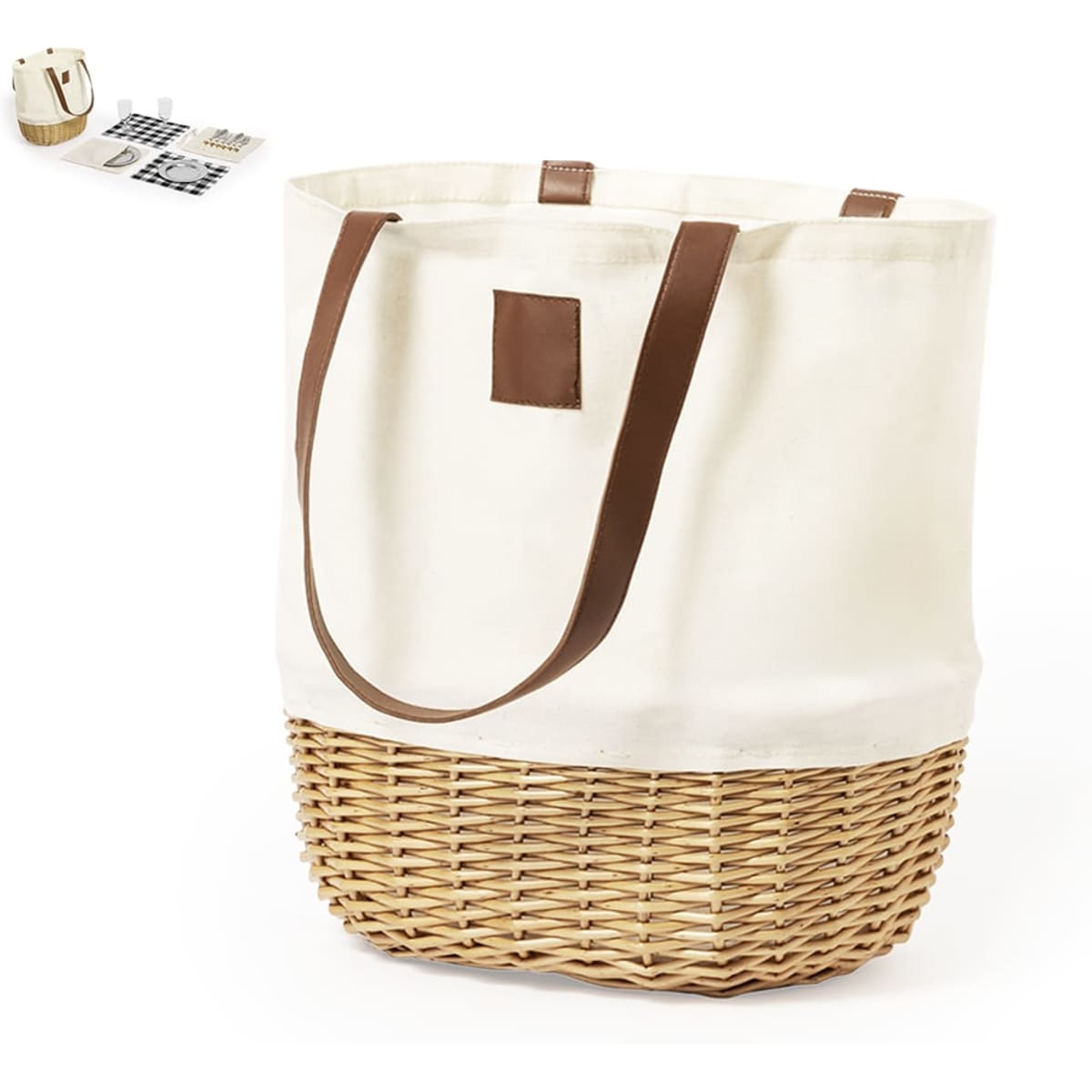 A woven picnic basket with a cream fabric top and brown leather handles, featuring a logo.