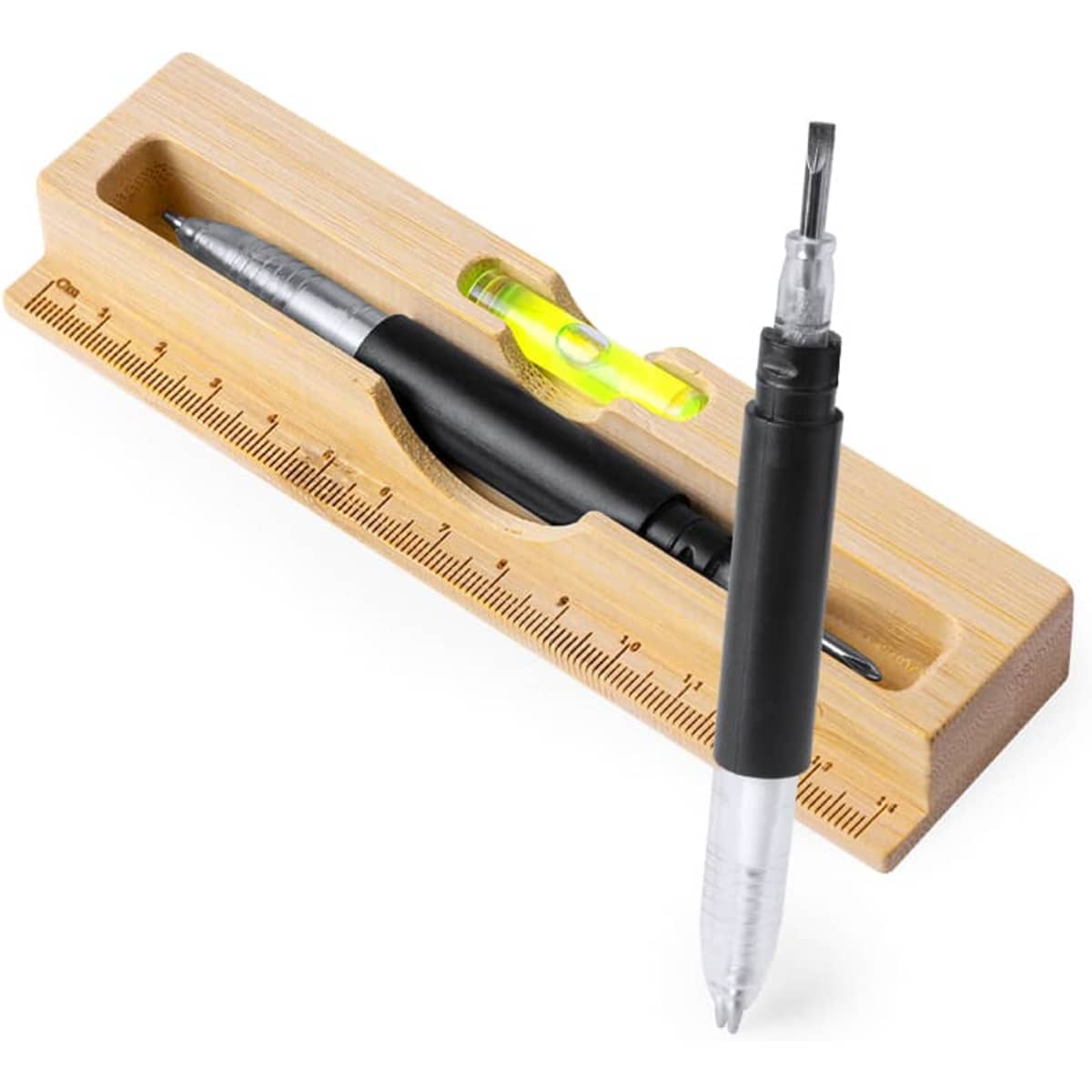 A bamboo desk organiser containing a silver pen, a black pen, and a ruler with a bubble level.