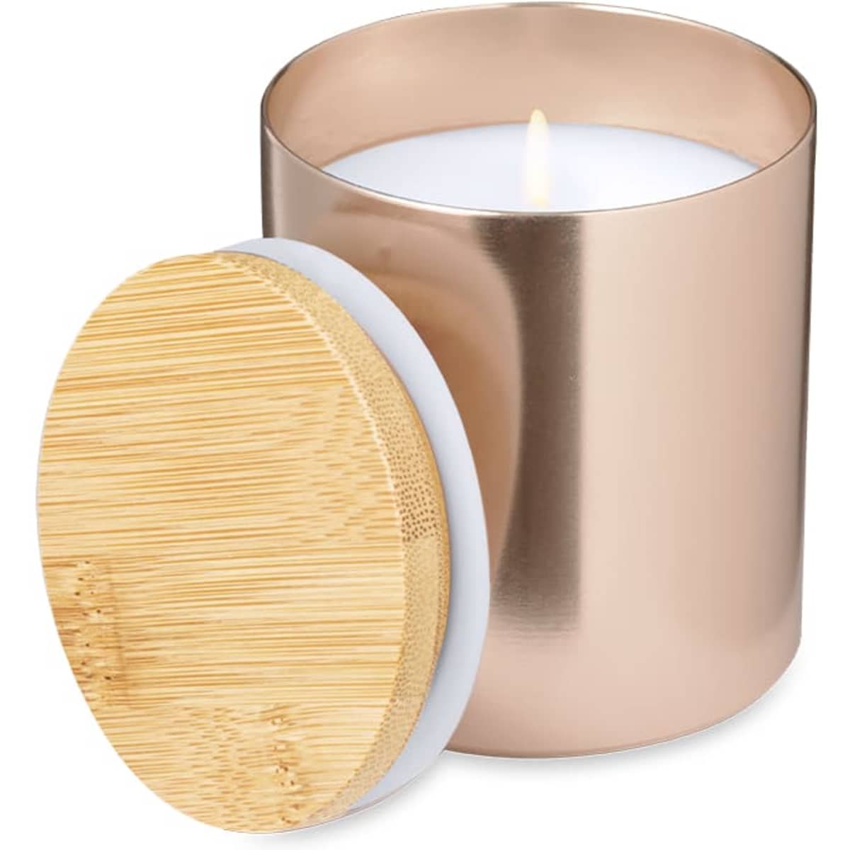 A rose gold candle in a metallic container with a bamboo lid, featuring a lit white wax candle inside.