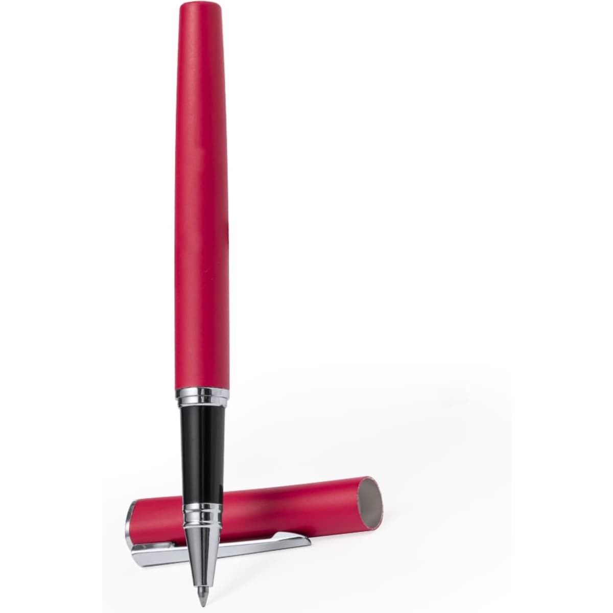 A red metal pen rests on its side, with the cap nearby. The pen features a sleek design and a chrome clip.