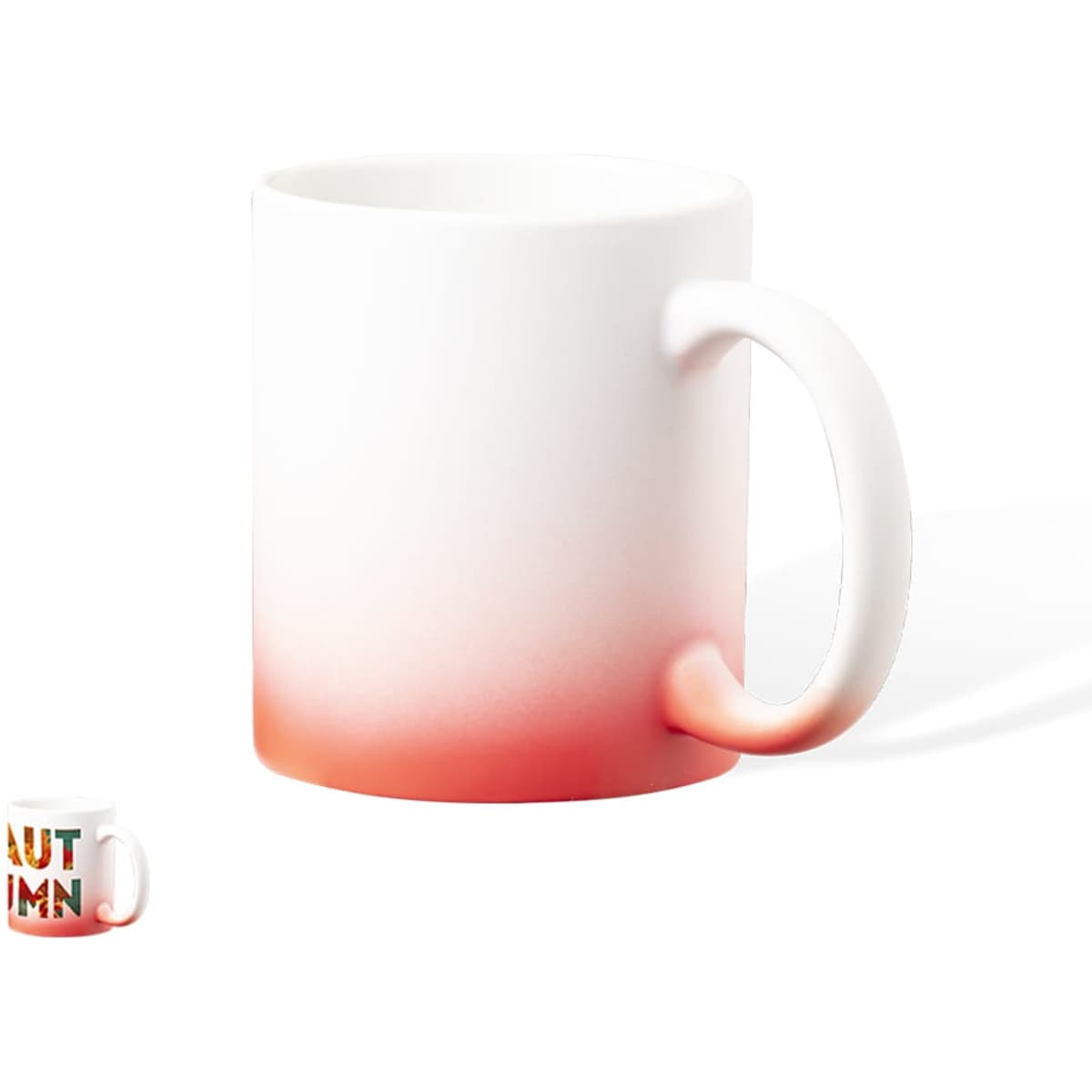 A coffee mug with a gradient design, transitioning from white to vibrant red at the base. Features a handle and a logo.