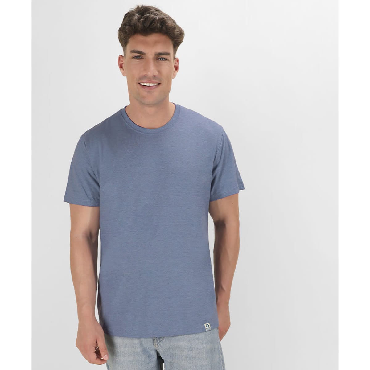 A blue T-shirt with short sleeves and a fitted design, featuring a logo at the hem.