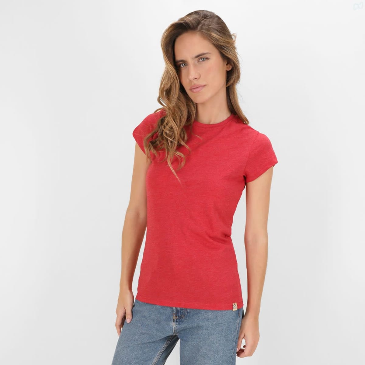 A red T-shirt for women displayed on a model, featuring short sleeves and a fitted design. It has a logo.