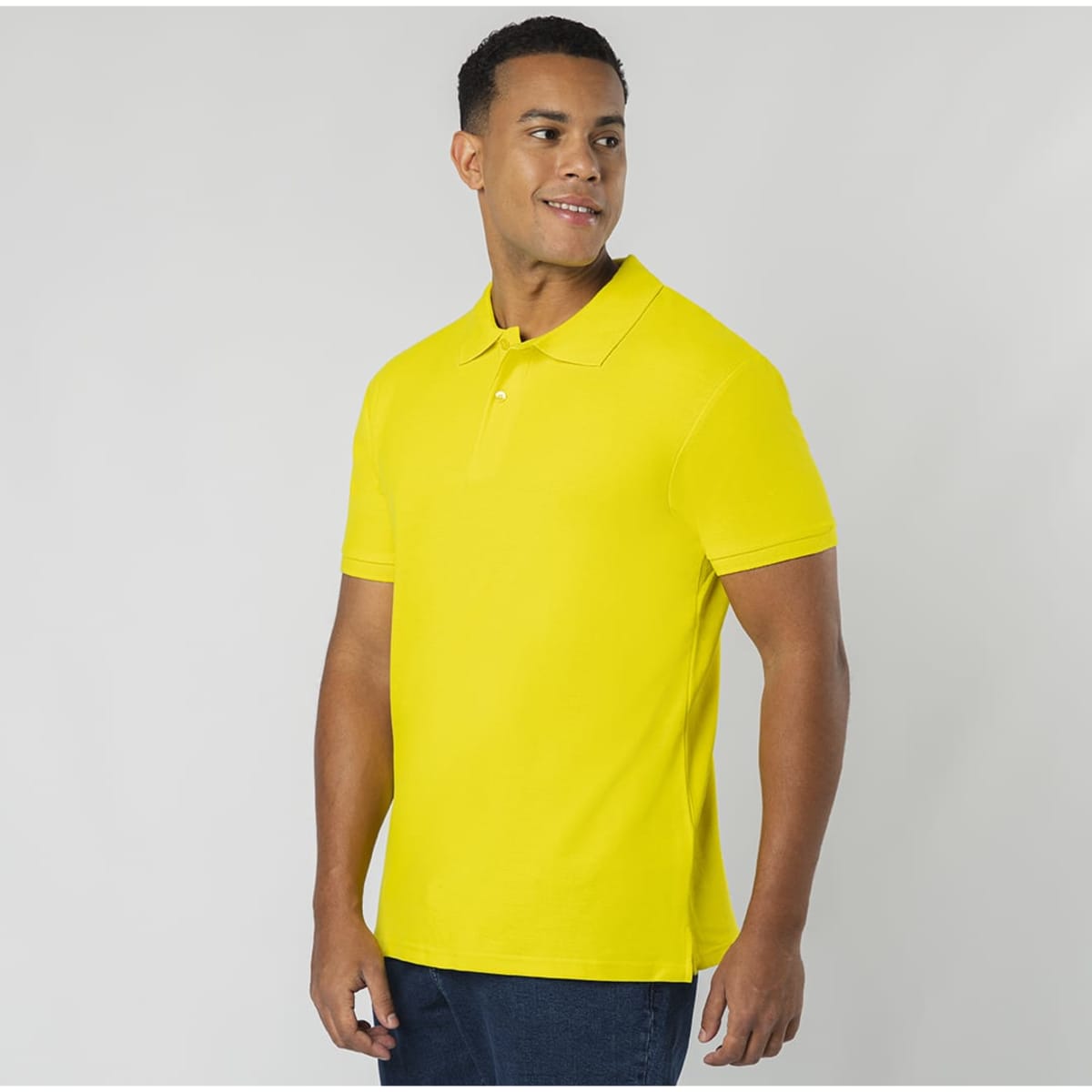 A yellow Koupan polo shirt with a collar and short sleeves, featuring a logo on the chest.