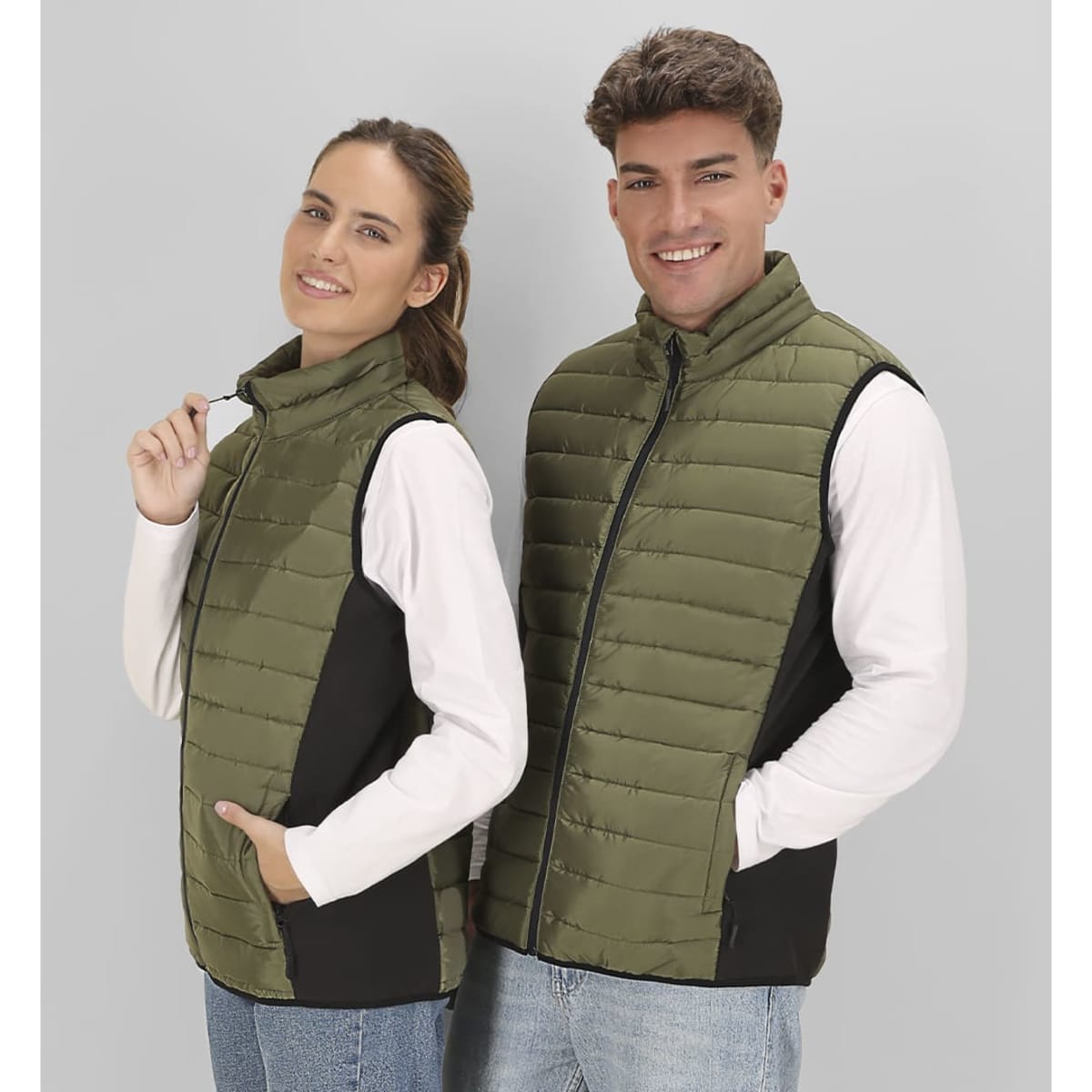 A soft shell jacket in olive green and black, featuring a front zip and a fitted design for men and women.