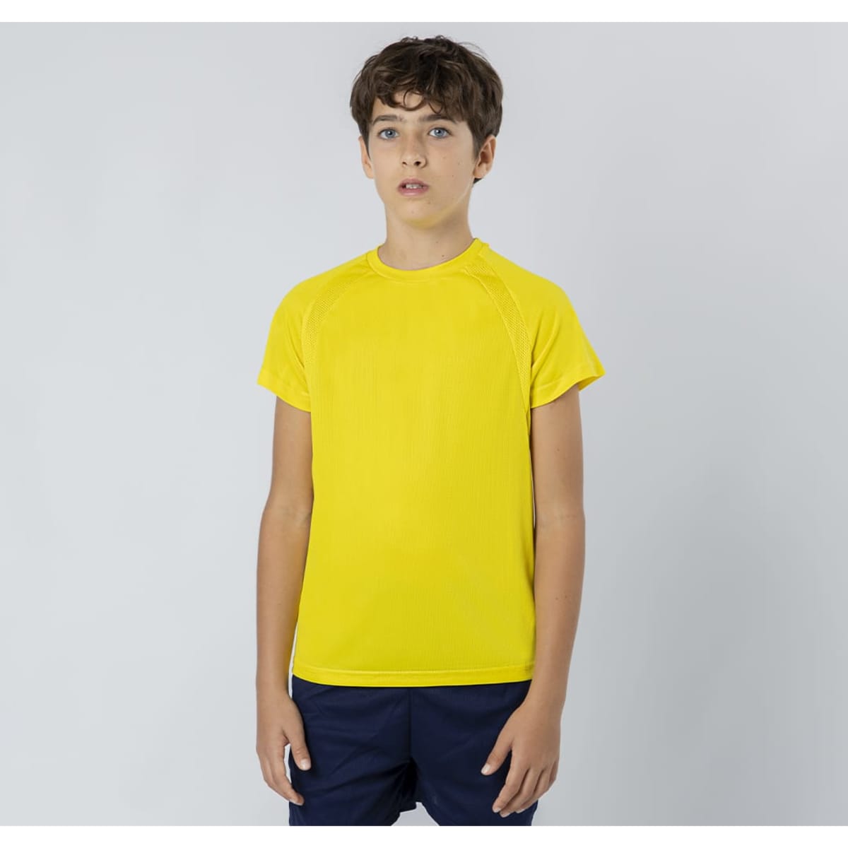 A bright yellow Sappor T-Shirt displayed on a young model, featuring a simple design and a logo.