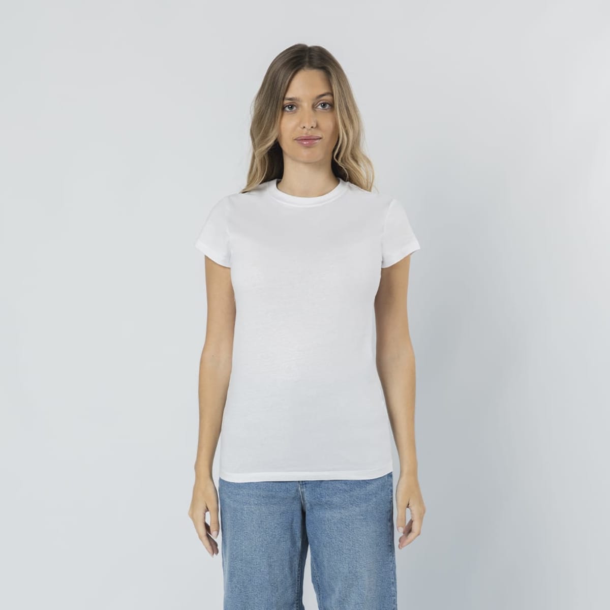A fitted white t-shirt displayed on a model, featuring a simple design and a round neckline.