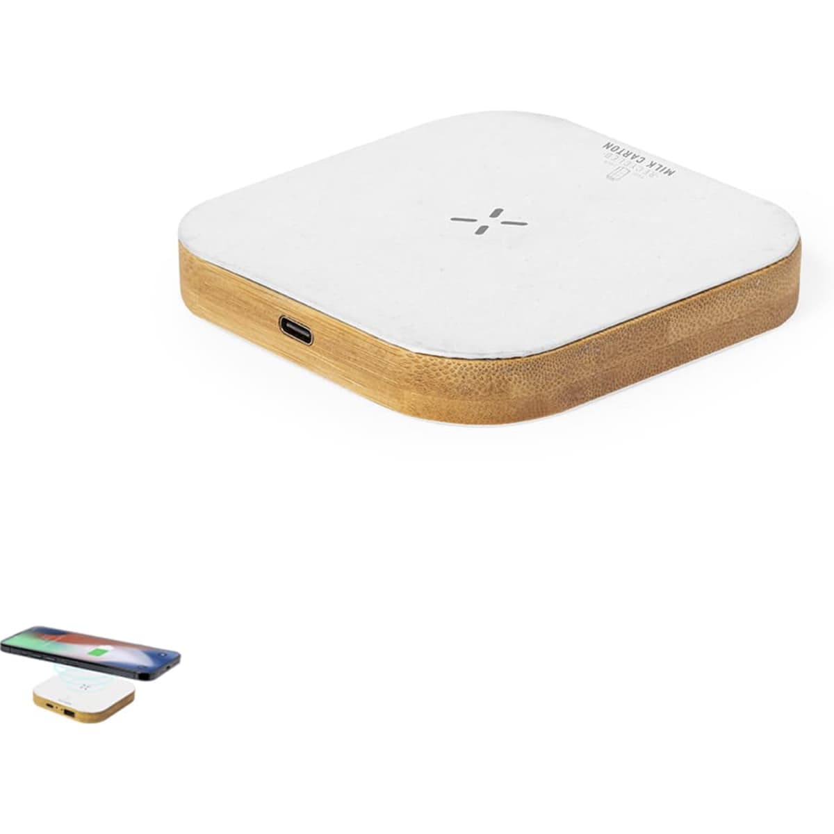 A square wireless charger with a white top and wooden base, featuring a logo and a device being charged beside it.