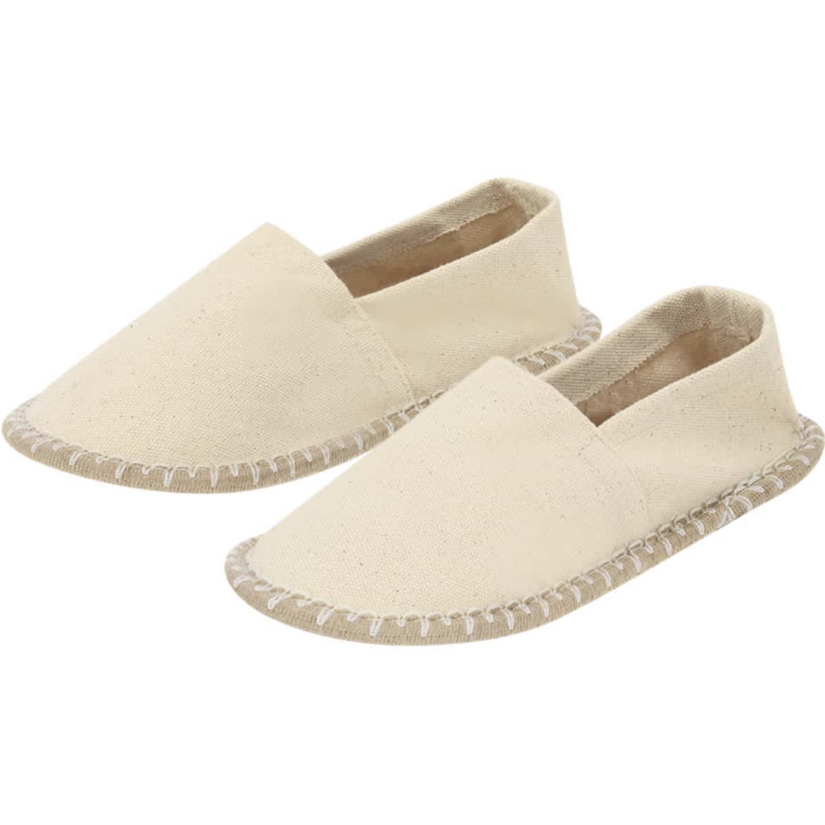 A pair of beige slip-on footwear with a woven sole and soft upper. Features a simple, minimalistic design.