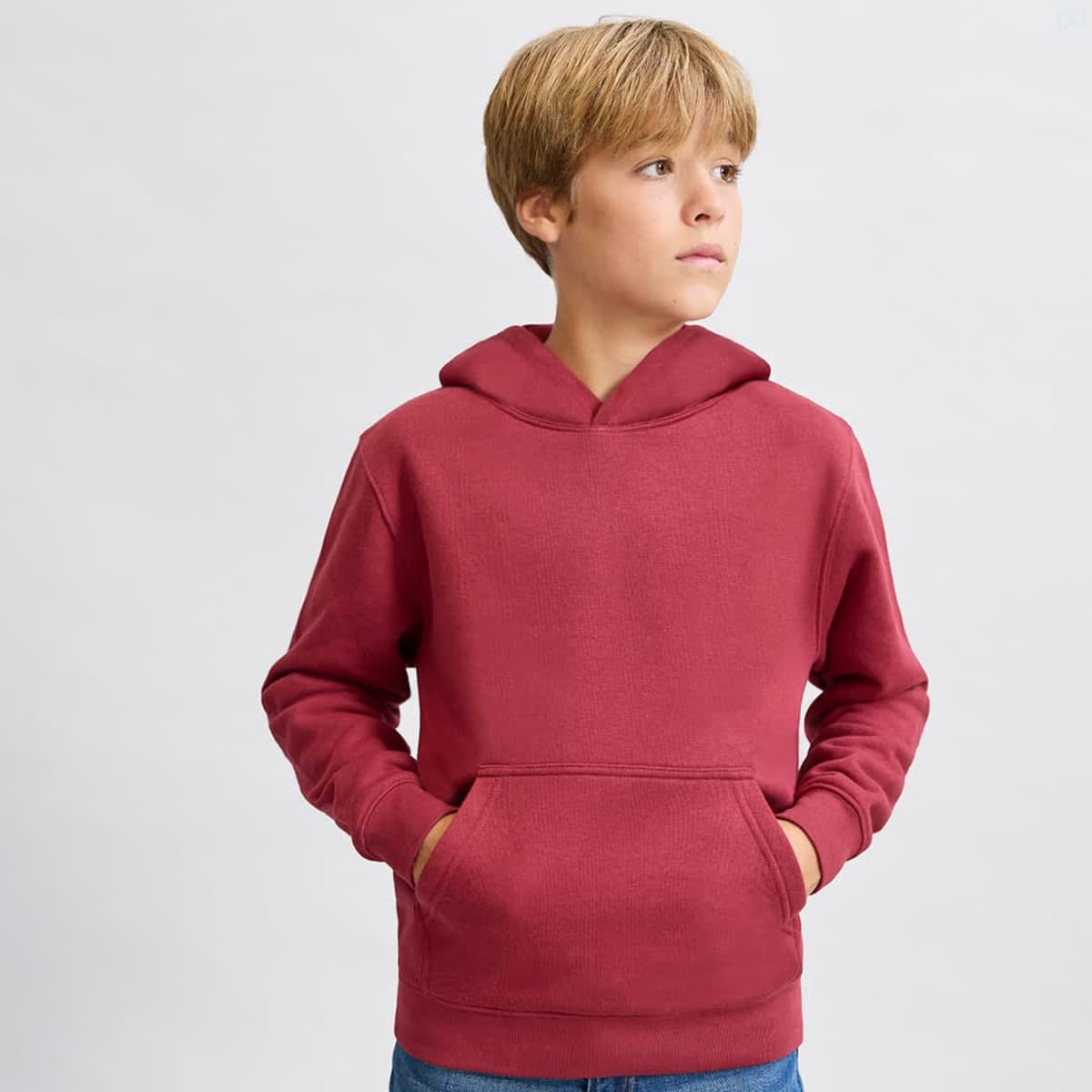 A maroon hoodie with a front pocket and a hood, featuring a simple design and a logo.