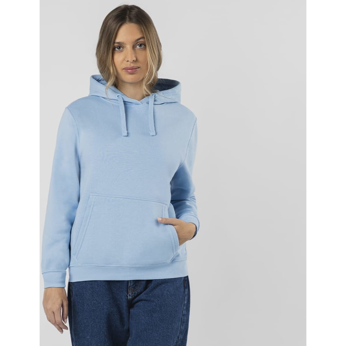 A light blue hoodie featuring a front pocket and a drawstring hood, worn by a model.