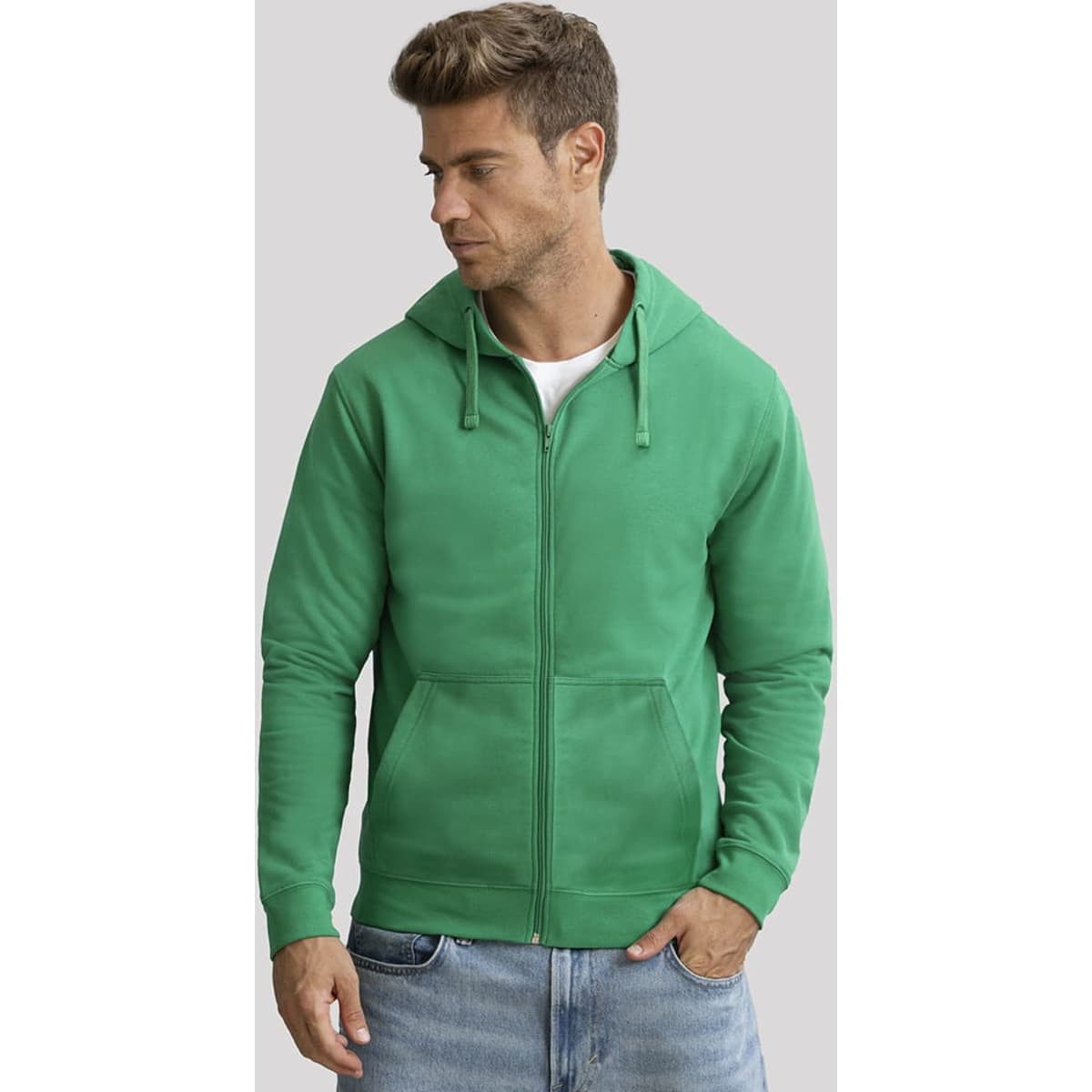 A green zip-up hoodie with a front pocket and drawstring hood, worn by a model. It features a logo on one side.