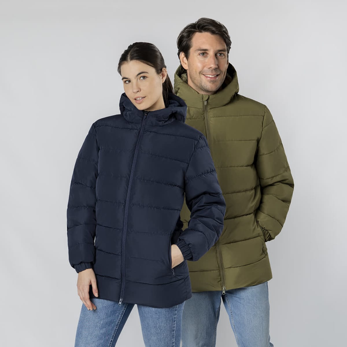 A navy puffer jacket and an olive green puffer jacket with hoods, worn by models, feature a smooth design and branding.