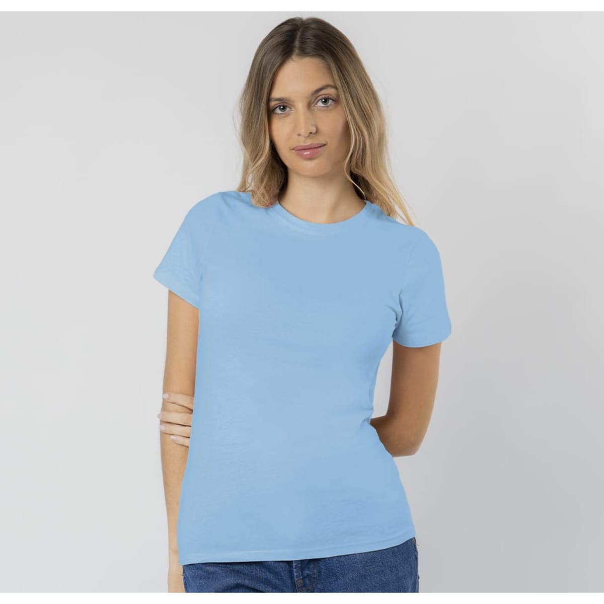 A light blue T-shirt with short sleeves, featuring a logo on the front, displayed on a model.