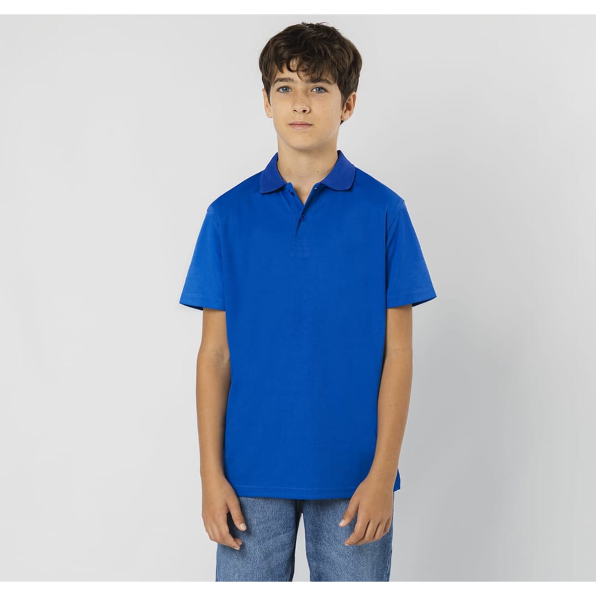 A blue polo shirt featuring a collar and short sleeves, displayed on a model. The shirt has a logo.